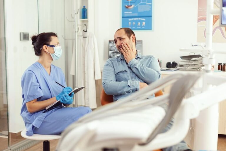 dental-assistant-writing-stomatology-treatment-clipboard-dental-clinic-sick-patient-check-up (1) الأخطاء الشائعة بعد مغادرة NHS - mistakes leaving nhs care
